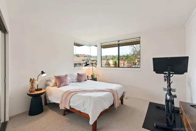 a bedroom with bed and a window