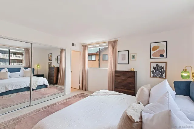 a bedroom with a bed and a couch