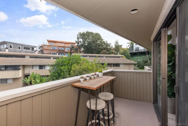 a view of a balcony with furniture