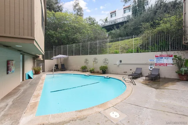 a view of a swimming pool with a patio