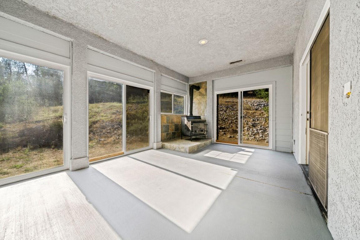 8418 Placer Road Redding, CA 96001 - Photo 14 of 47 a bedroom with a bed and a large window