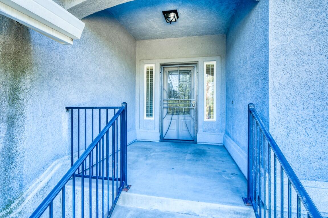 8418 Placer Road Redding, CA 96001 - Photo 31 of 47 a view of a hallway with wooden floor and entryway