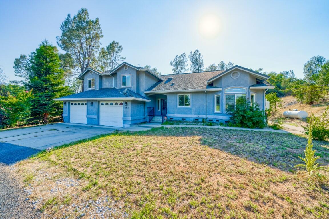 8418 Placer Road Redding, CA 96001 - Photo 32 of 47 a view of house with yard and outdoor space