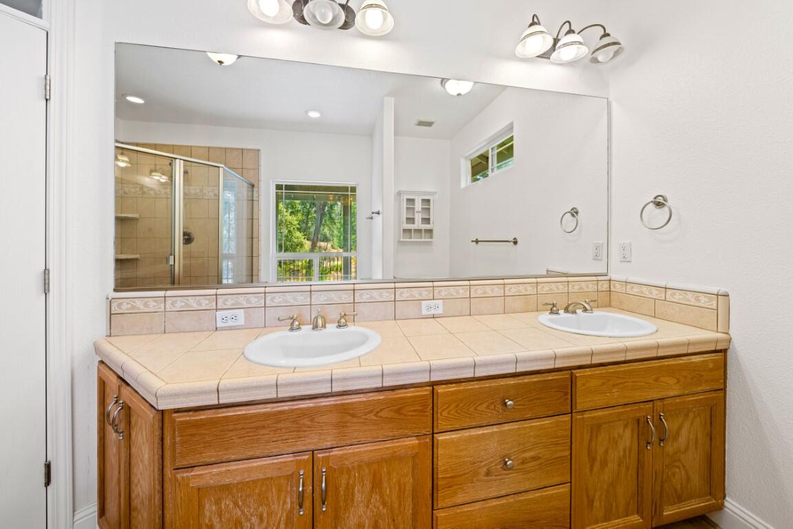 8418 Placer Road Redding, CA 96001 - Photo 10 of 47 a bathroom with a sink and a mirror