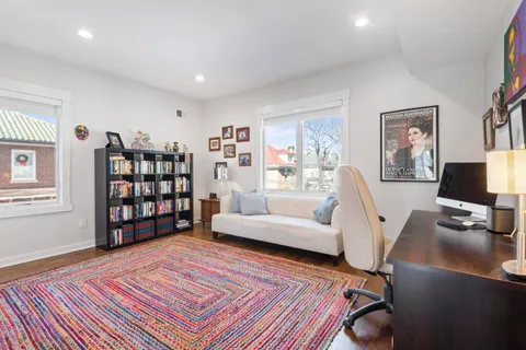 a bathroom with a sink a toilet and shower curtain
