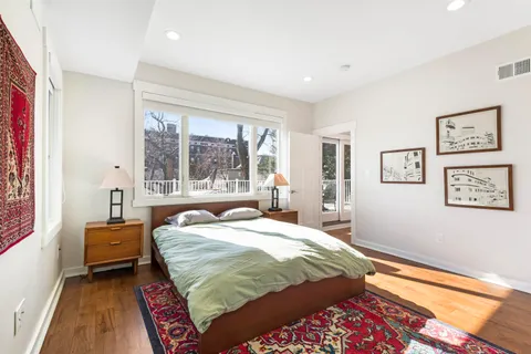 a bathroom with a sink vanity mirror and toilet