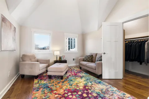 a bathroom with a granite countertop sink a toilet and a mirror