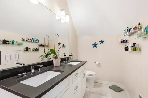 a kitchen with stainless steel appliances granite countertop a sink counter space cabinets and a large window