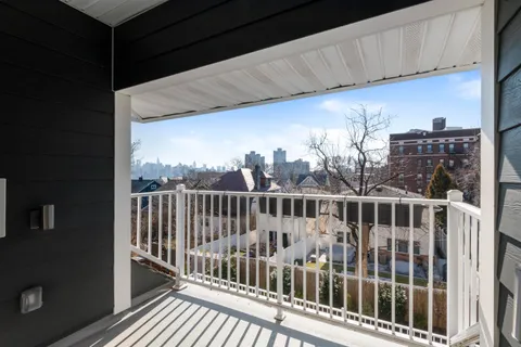 a kitchen with stainless steel appliances granite countertop a chairs counter space and cabinets