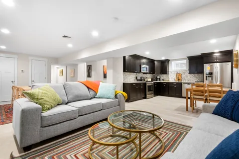 a dining room with furniture and wooden floor