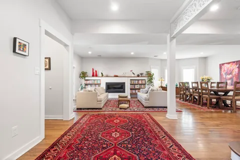 a living room with furniture and a rug