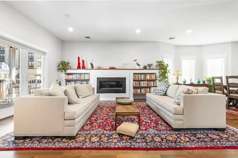 a living room with furniture and a rug