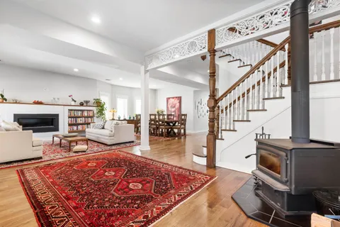 a living room with furniture rug and window