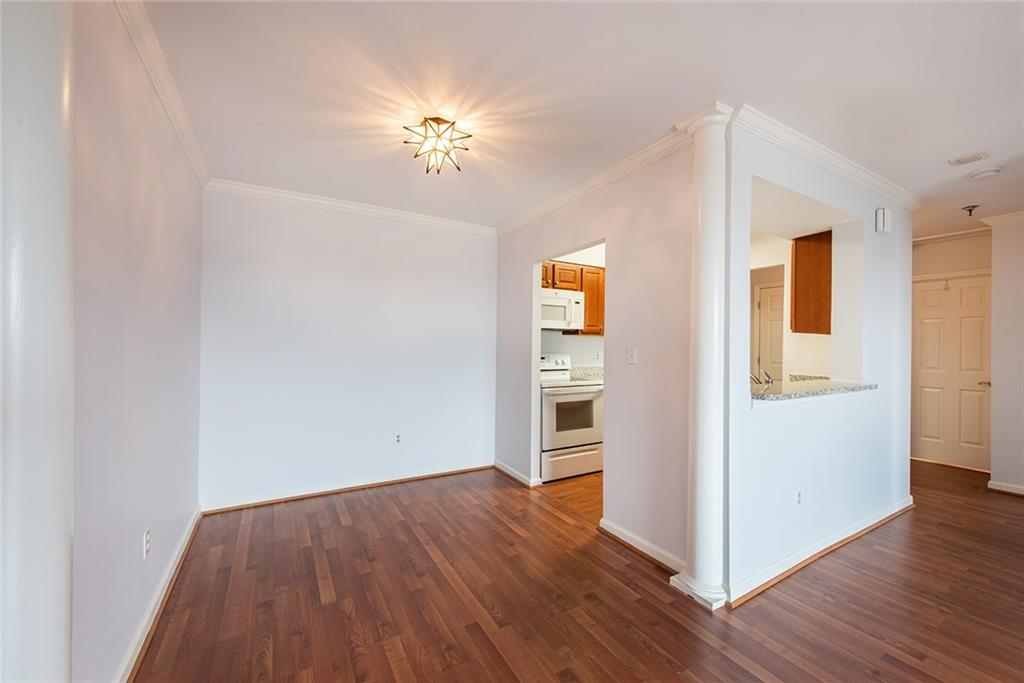 300 Johnson Ferry Road, Unit B808 Atlanta, GA 30328 - Photo 16 of 41 a view of empty room with wooden floor
