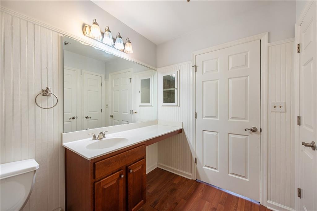 300 Johnson Ferry Road, Unit B808 Atlanta, GA 30328 - Photo 27 of 41 a view of bathroom with a sink mirror and toilet