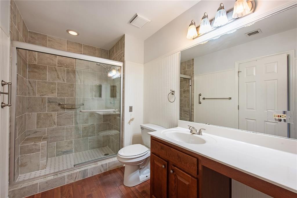 300 Johnson Ferry Road, Unit B808 Atlanta, GA 30328 - Photo 28 of 41 a bathroom with a sink a toilet and shower