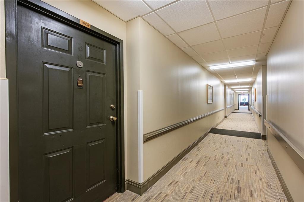 300 Johnson Ferry Road, Unit B808 Atlanta, GA 30328 - Photo 5 of 41 a view of a hallway with wooden floor