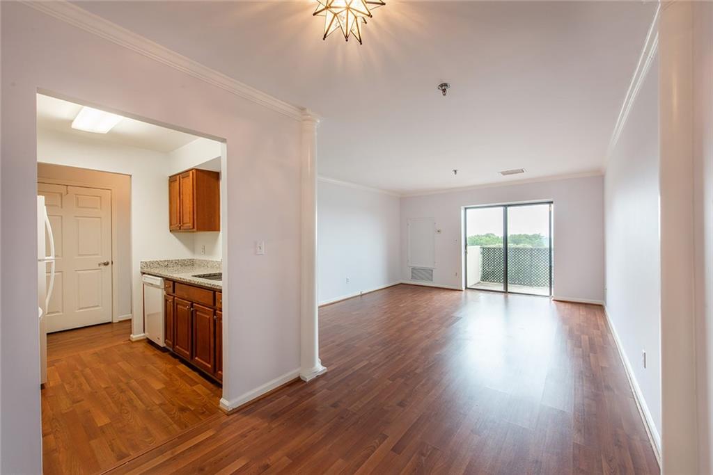 300 Johnson Ferry Road, Unit B808 Atlanta, GA 30328 - Photo 8 of 41 a view of a kitchen cabinets and wooden floor