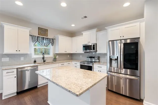 a view of entryway with wooden floor and stairs