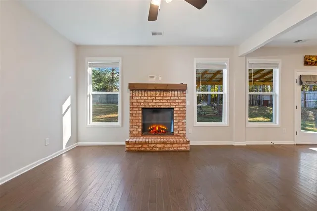 a bathroom with a shower sink and mirror
