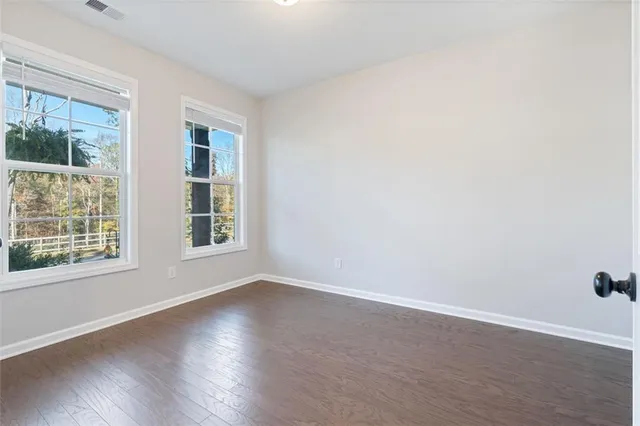 an empty room with windows