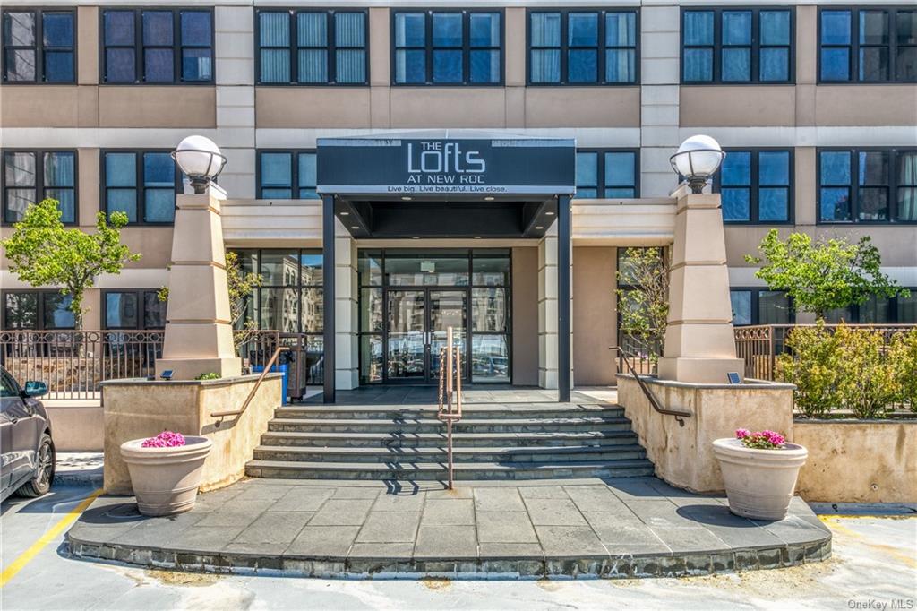100 New Roc City Place, Unit 414 New Rochelle, NY 10801 - Photo 1 of 1 a front view of a building with outdoor seating