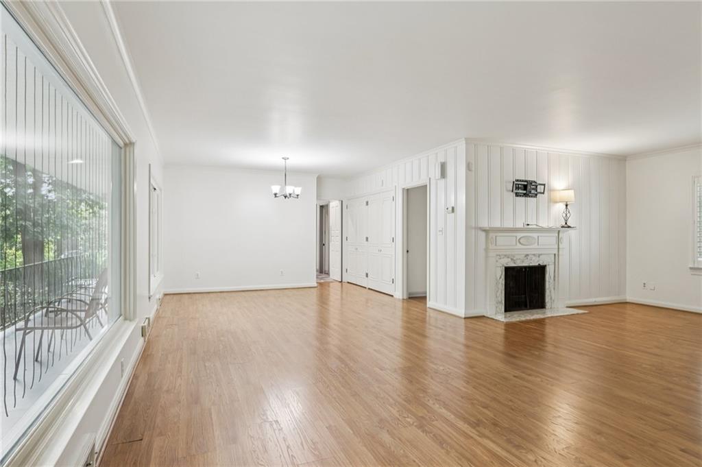 806 Belmont Road Butler, PA 16001 - Photo 15 of 49 a view of a livingroom with wooden floor a fireplace and windows