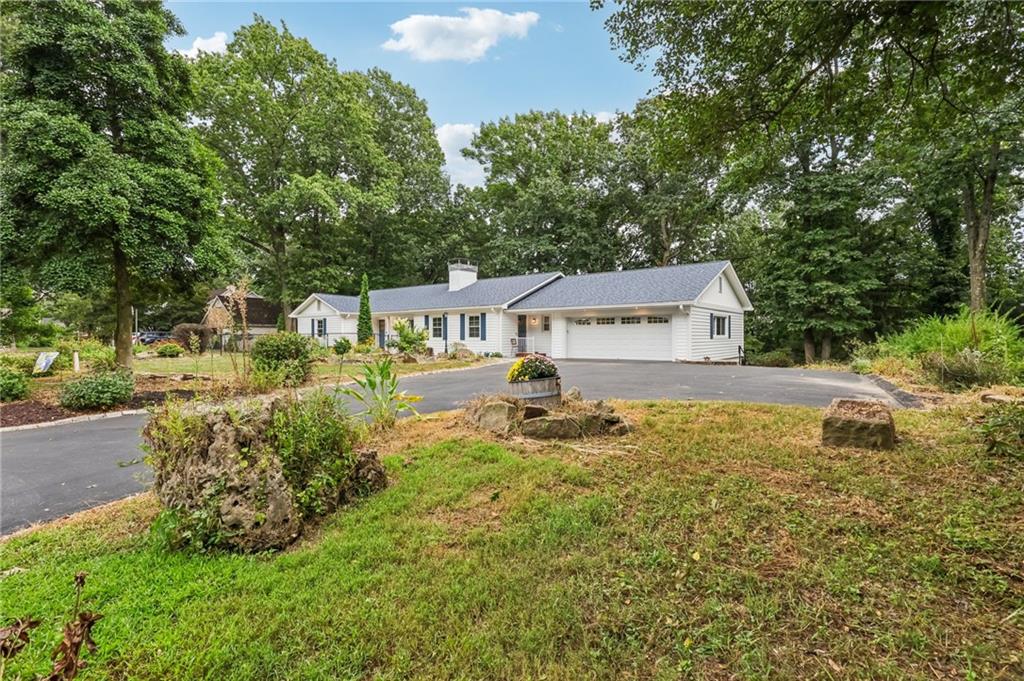 806 Belmont Road Butler, PA 16001 - Photo 2 of 49 a swimming pool with outdoor seating and yard