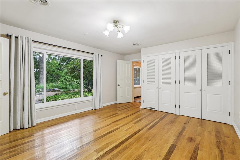 806 Belmont Road Butler, PA 16001 - Photo 21 of 49 a view of empty room with wooden floor and fan