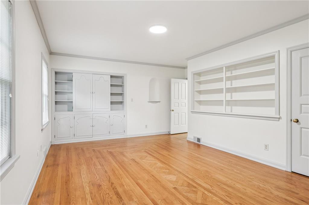806 Belmont Road Butler, PA 16001 - Photo 22 of 49 wooden floor in an empty room with a window