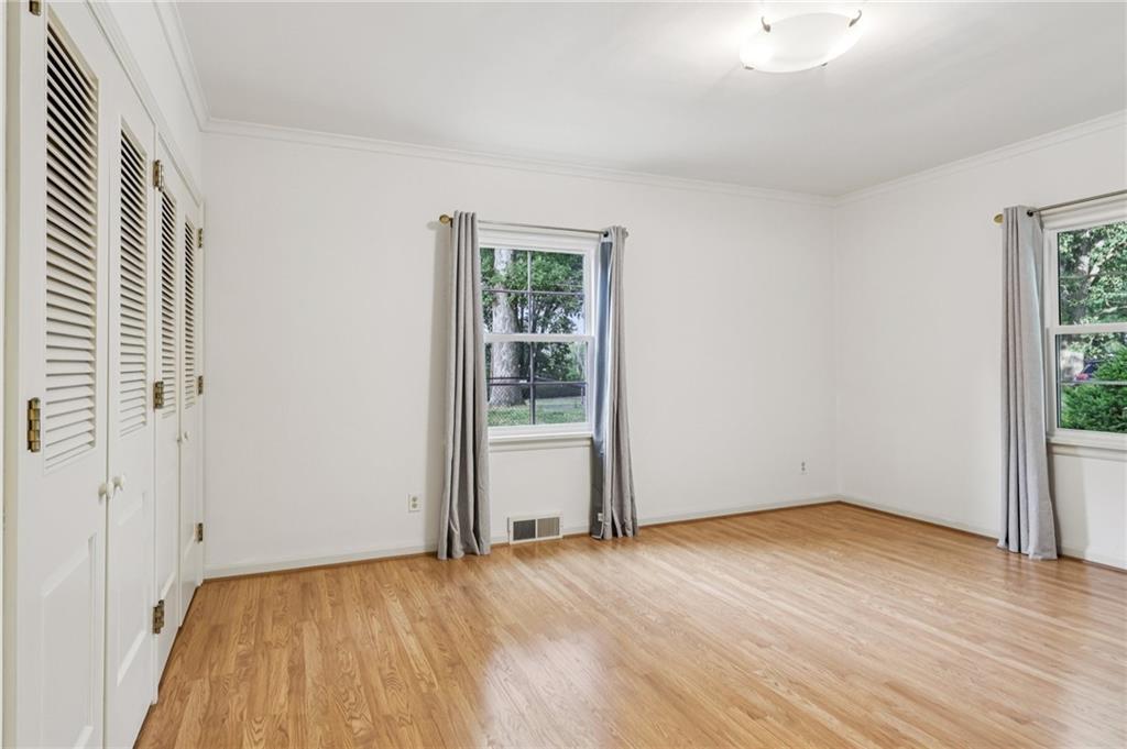 806 Belmont Road Butler, PA 16001 - Photo 26 of 49 an empty room with wooden floor and windows
