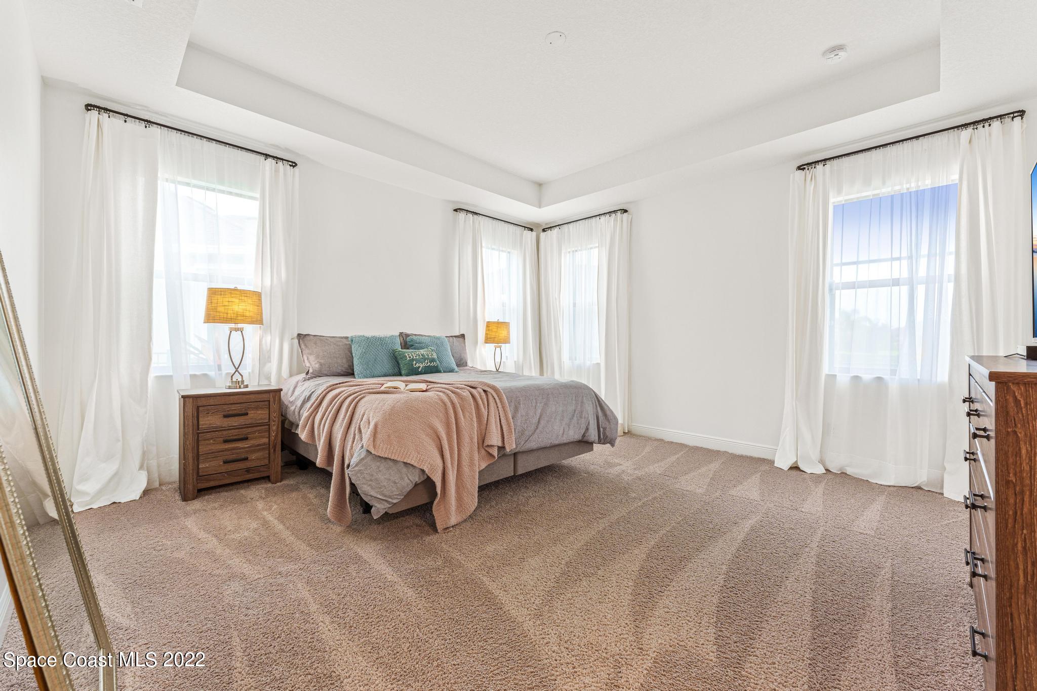 3231 Casterton Drive Melbourne, FL 32940 - Photo 35 of 88 a bedroom with a bed and a window