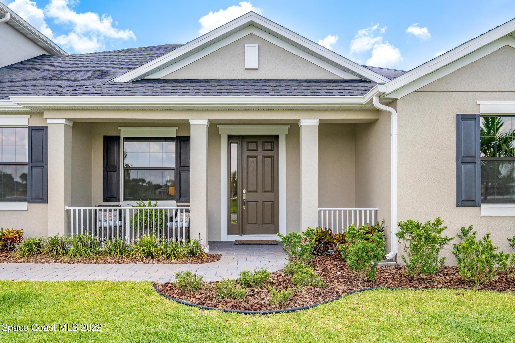 3231 Casterton Drive Melbourne, FL 32940 - Photo 4 of 88 a front view of a house