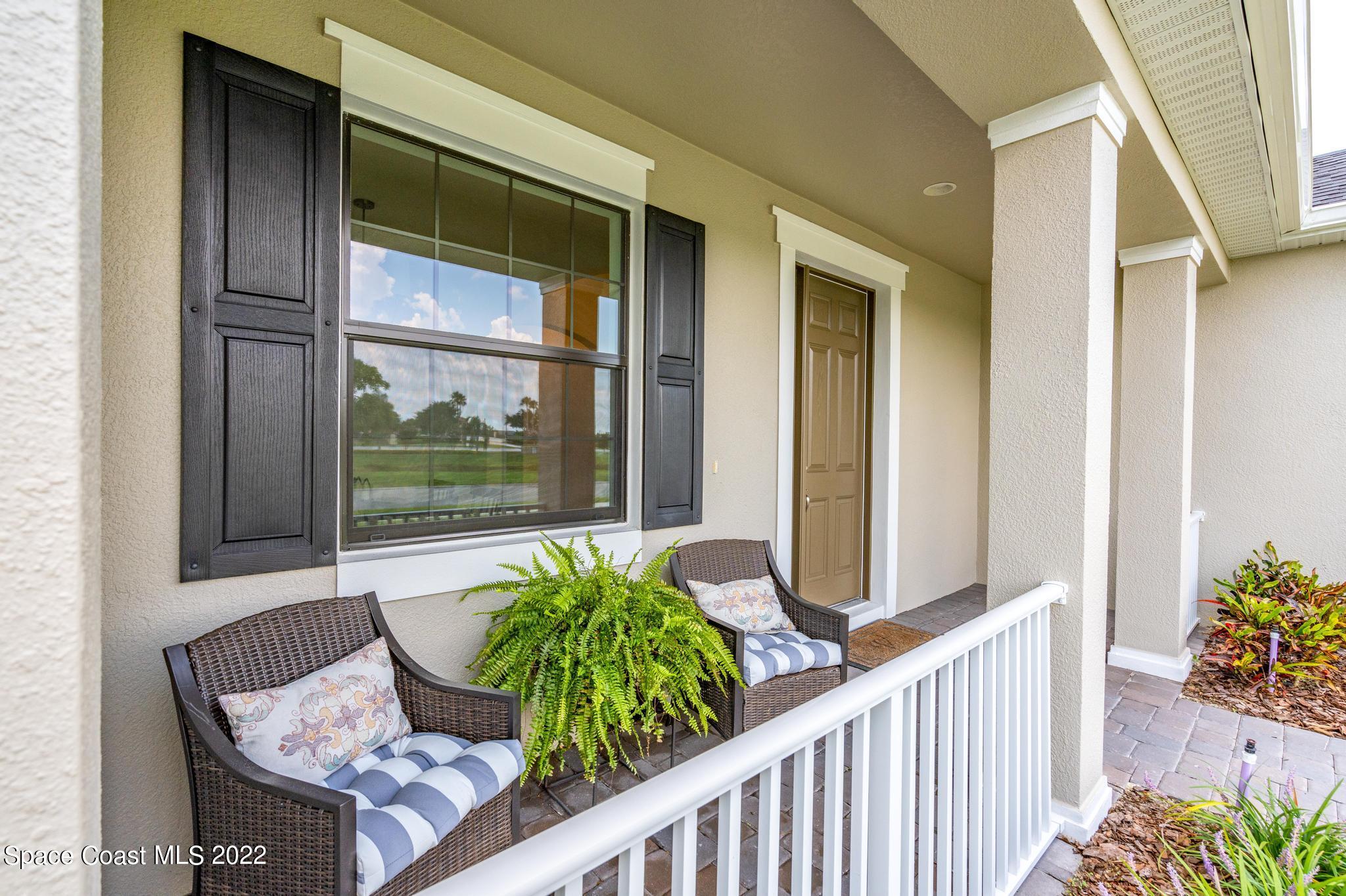 3231 Casterton Drive Melbourne, FL 32940 - Photo 5 of 88 a view of a porch with a table and chairs