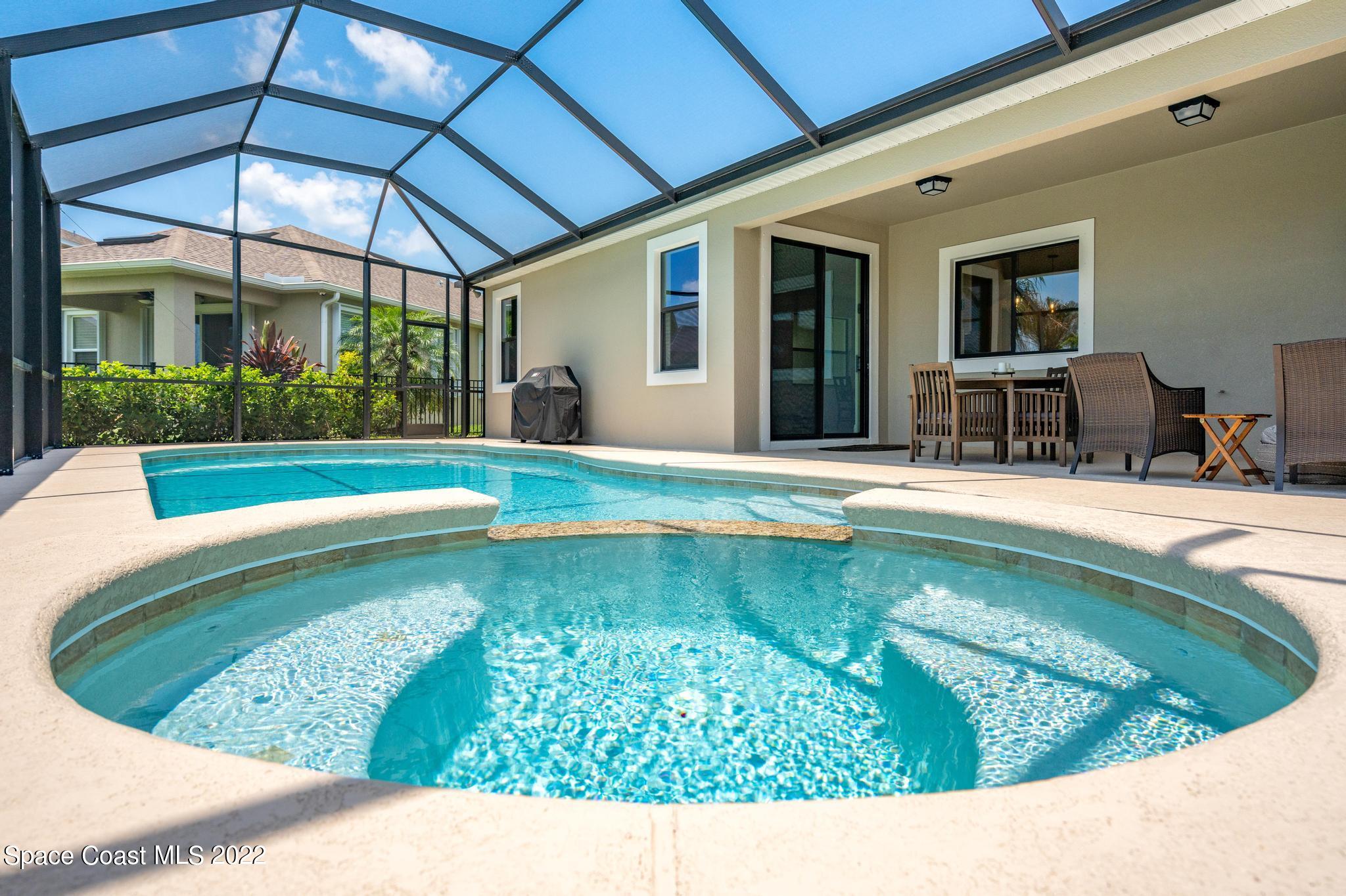 3231 Casterton Drive Melbourne, FL 32940 - Photo 56 of 88 a view of a swimming pool with a patio