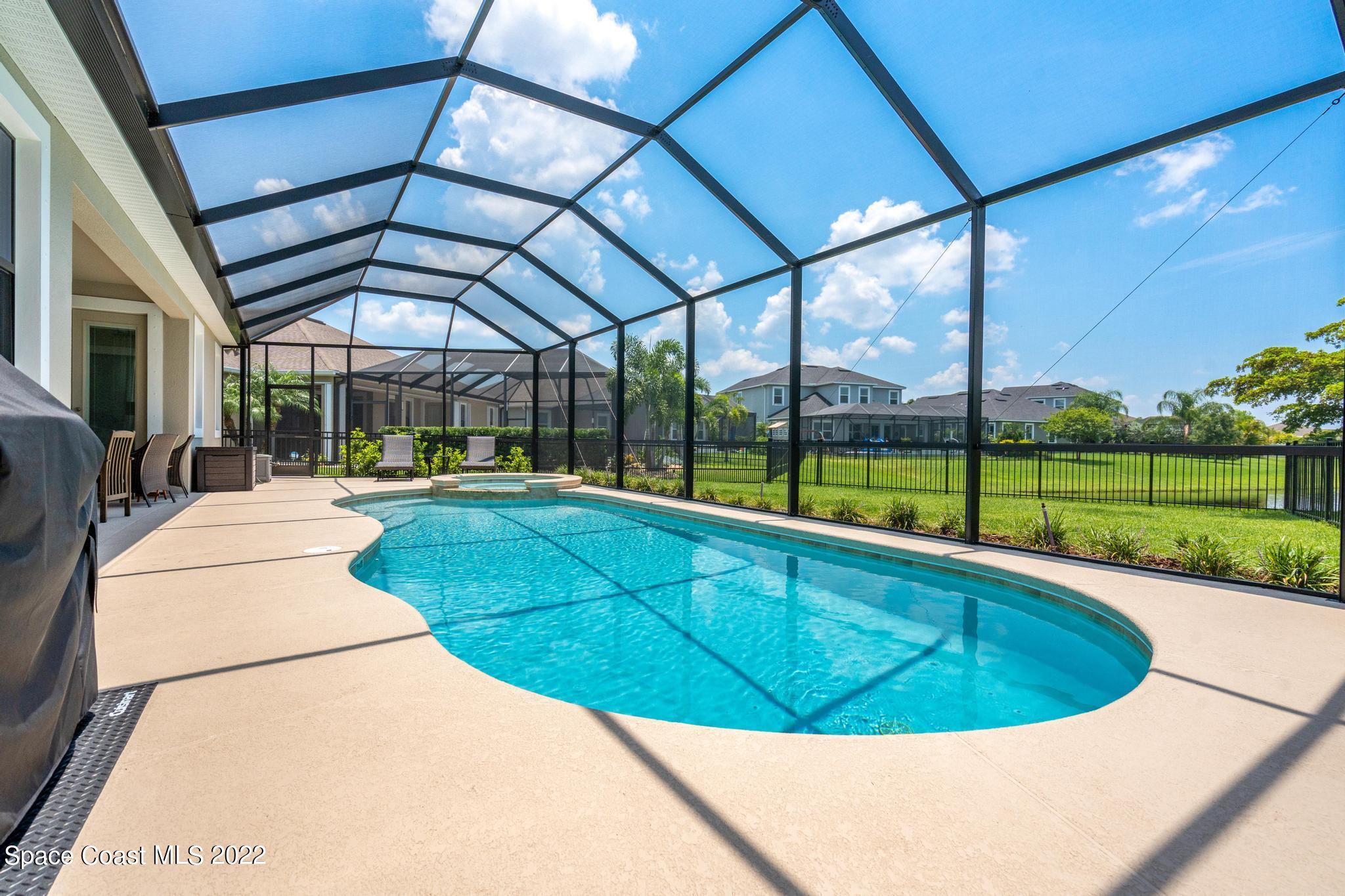 3231 Casterton Drive Melbourne, FL 32940 - Photo 59 of 88 a view of swimming pool with a patio
