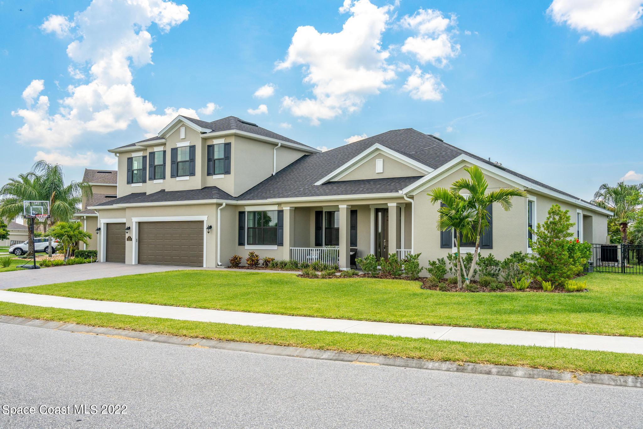 3231 Casterton Drive Melbourne, FL 32940 - Photo 66 of 88 a front view of a house with a yard