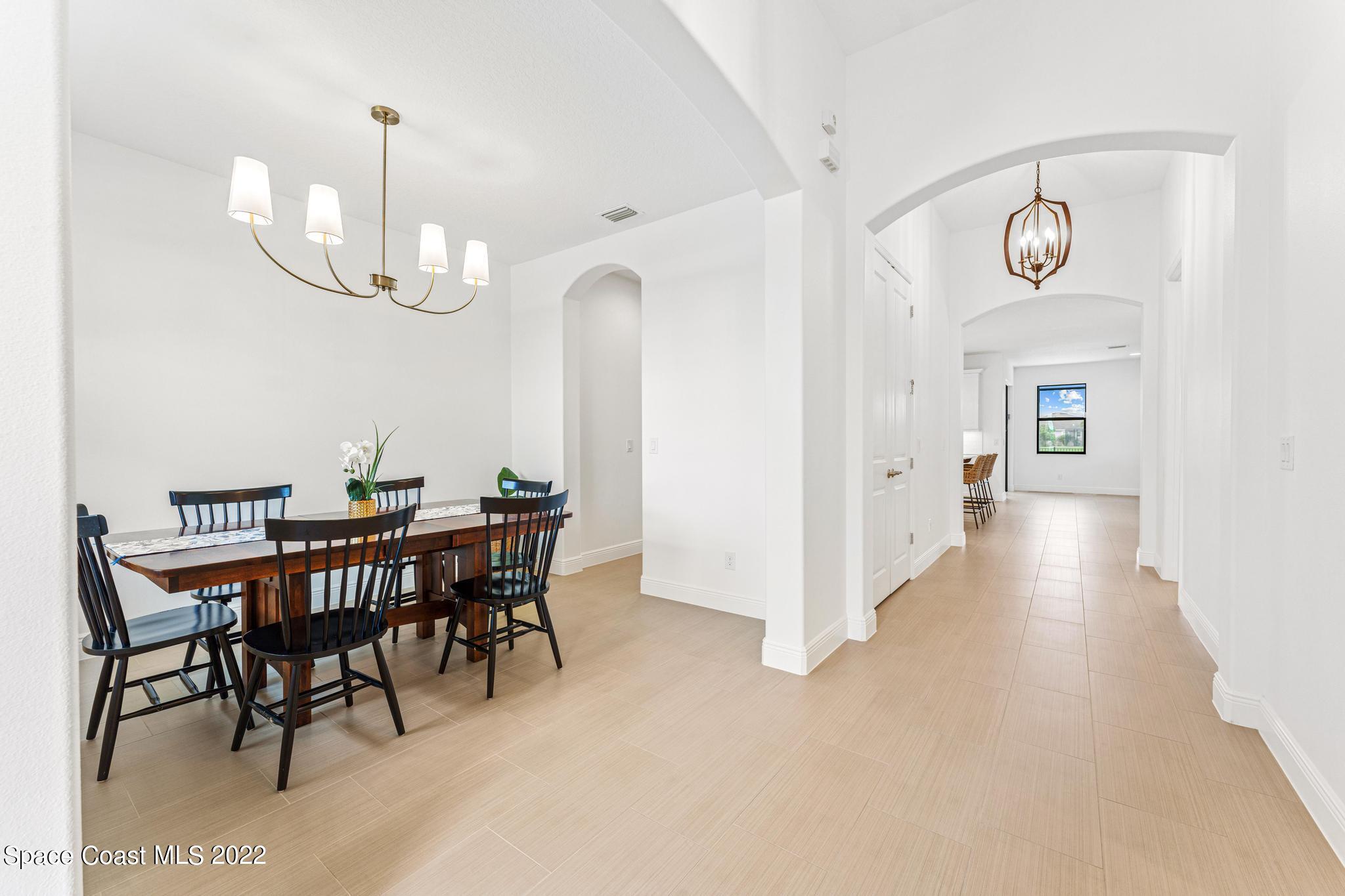 3231 Casterton Drive Melbourne, FL 32940 - Photo 7 of 88 a view of a dining room with furniture