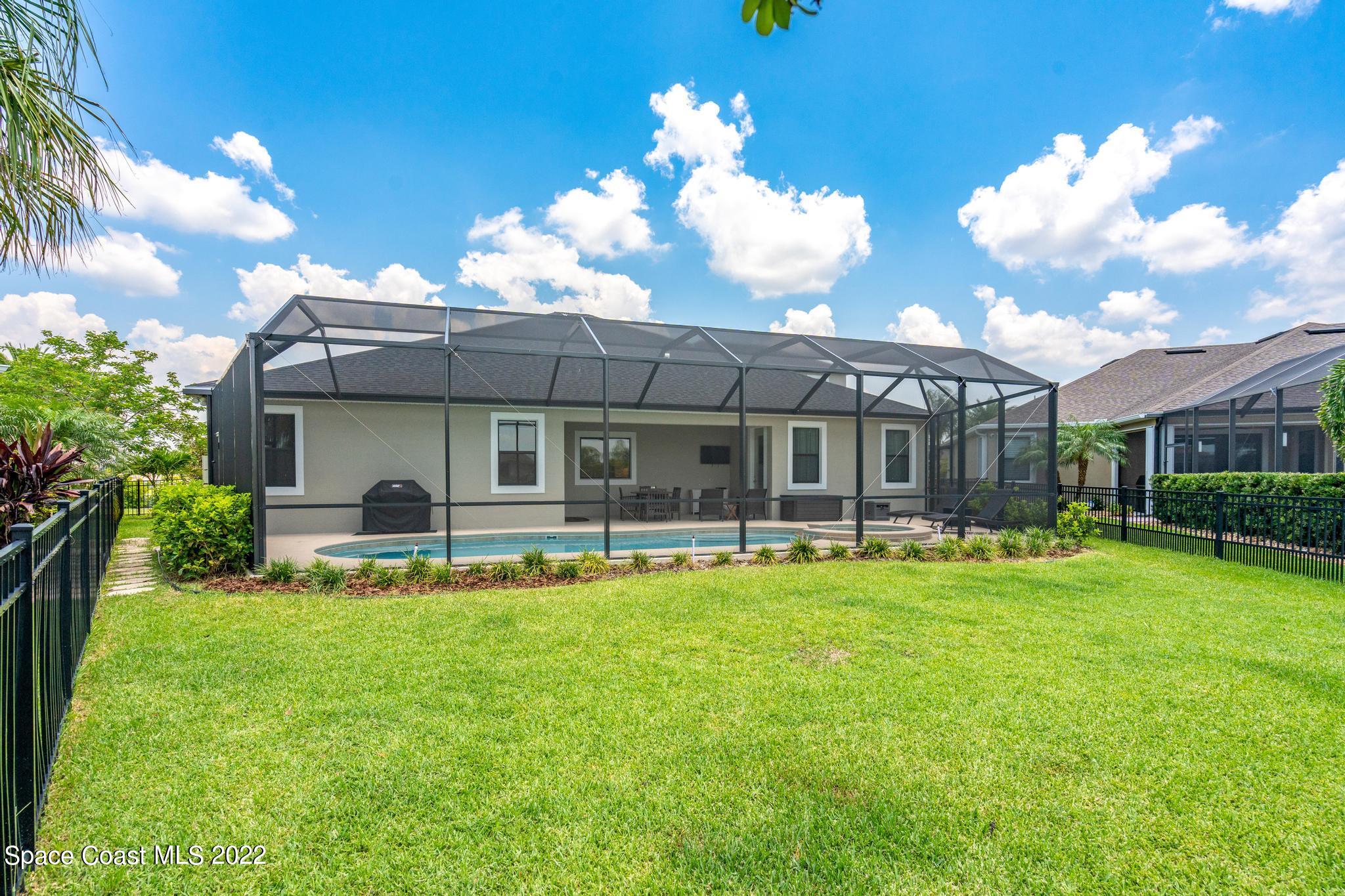3231 Casterton Drive Melbourne, FL 32940 - Photo 72 of 88 a view of a house with a yard porch and sitting area
