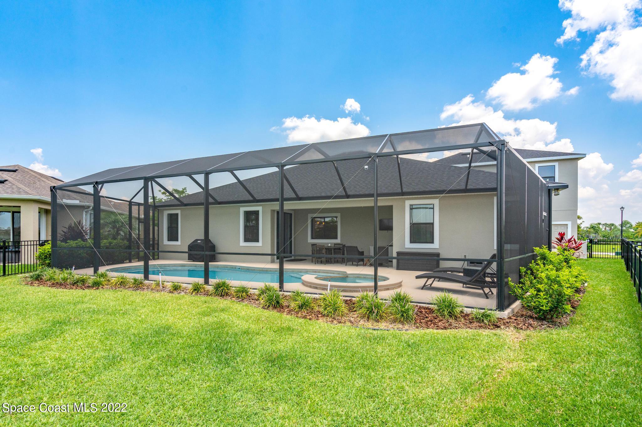 3231 Casterton Drive Melbourne, FL 32940 - Photo 73 of 88 a swimming pool view with a seating space