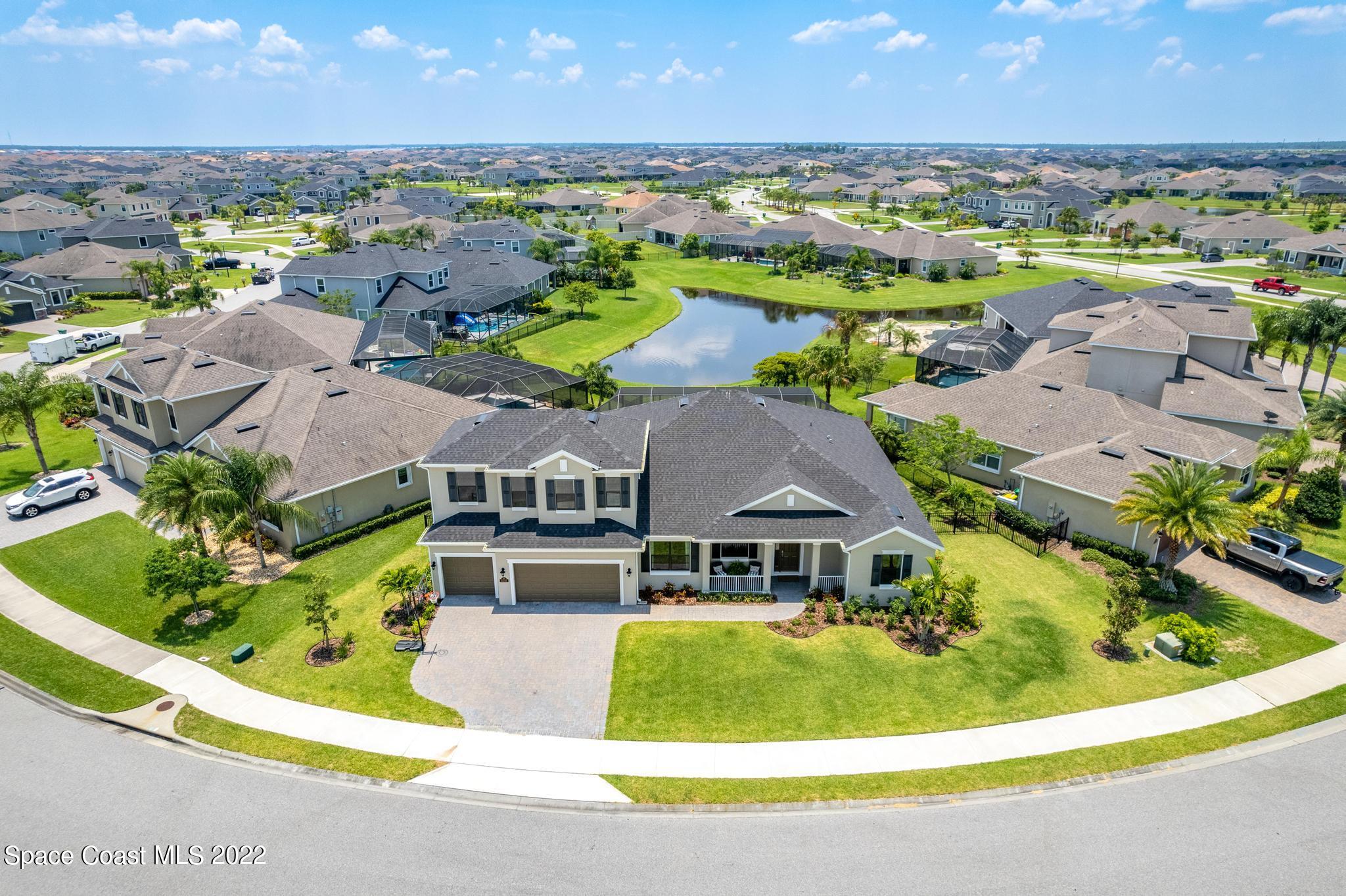 3231 Casterton Drive Melbourne, FL 32940 - Photo 76 of 88 an aerial view of residential house with outdoor space and swimming pool