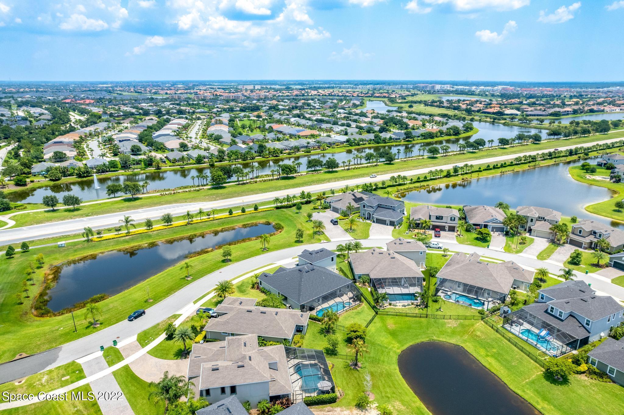 3231 Casterton Drive Melbourne, FL 32940 - Photo 81 of 88 an aerial view of residential houses with outdoor space and river