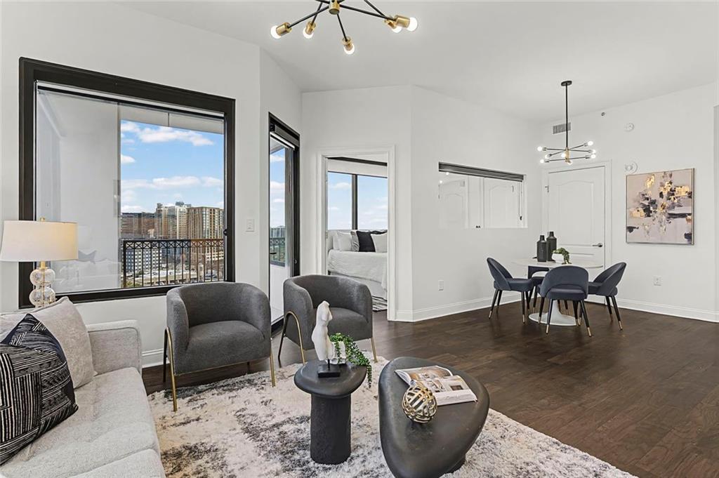 2828 Peachtree Road Northwest, Unit 1704 Atlanta, GA 30305 - Photo 12 of 41 a living room with furniture and a large window