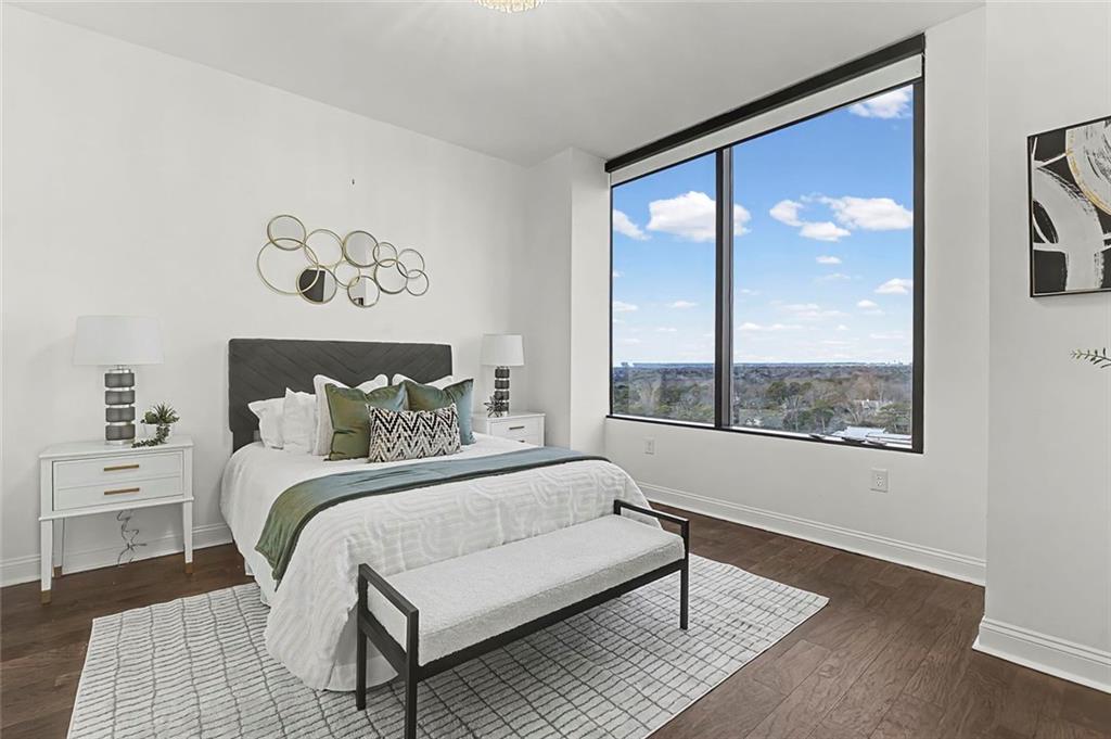2828 Peachtree Road Northwest, Unit 1704 Atlanta, GA 30305 - Photo 17 of 41 a bedroom with a large bed and a window