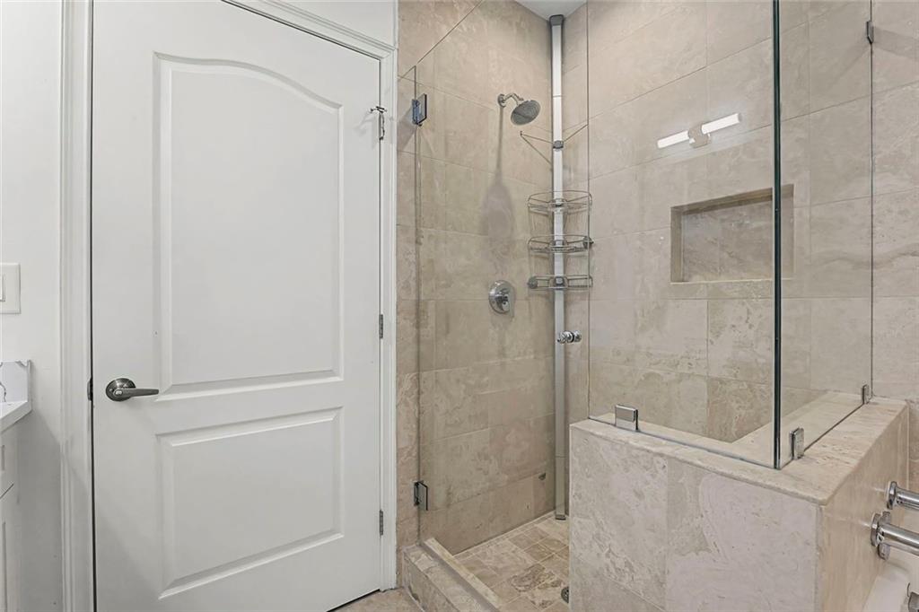 2828 Peachtree Road Northwest, Unit 1704 Atlanta, GA 30305 - Photo 28 of 41 a bathroom with a shower