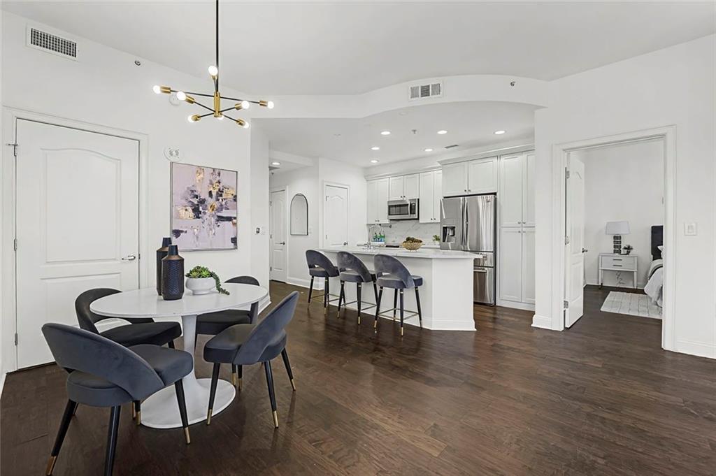 2828 Peachtree Road Northwest, Unit 1704 Atlanta, GA 30305 - Photo 9 of 41 a view of kitchen with furniture and wooden floor