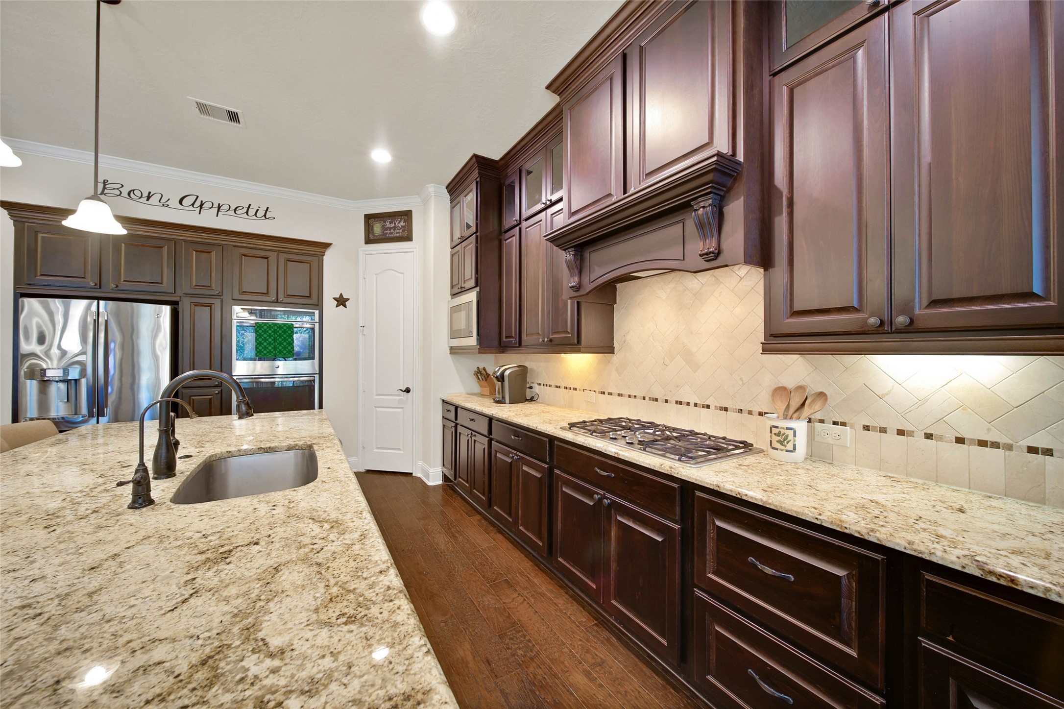 3234 Explorer Way Conroe, TX 77301 - Photo 20 of 46 Thoughtful layout combines style and practicality with extensive counters and workspace.