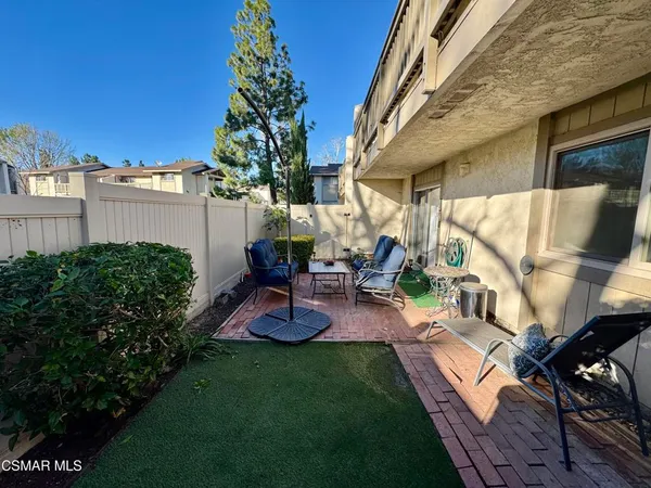 a view of yard with patio