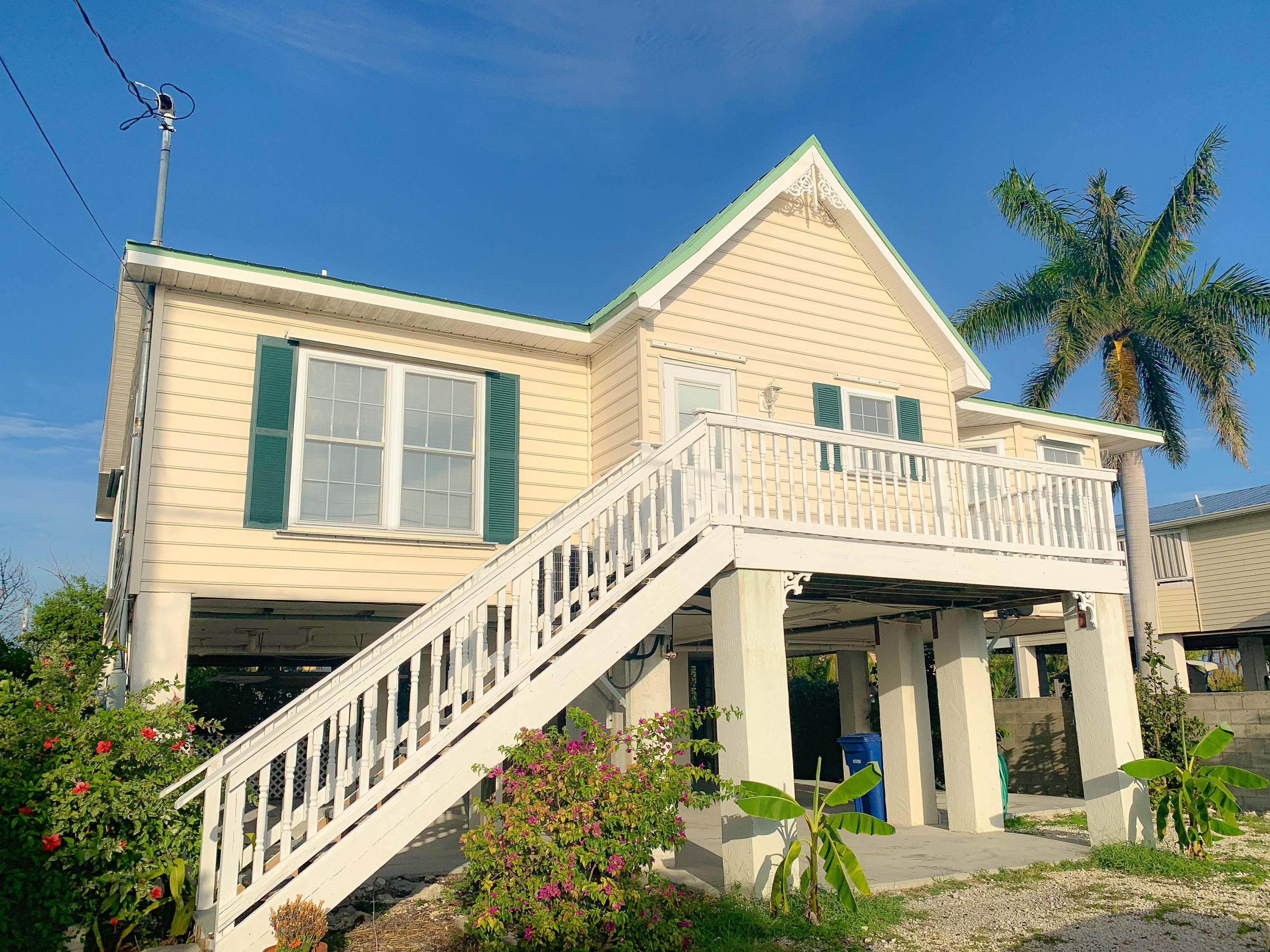 a view of a house with large windows and a couches