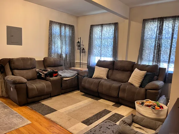 a living room with furniture and a window